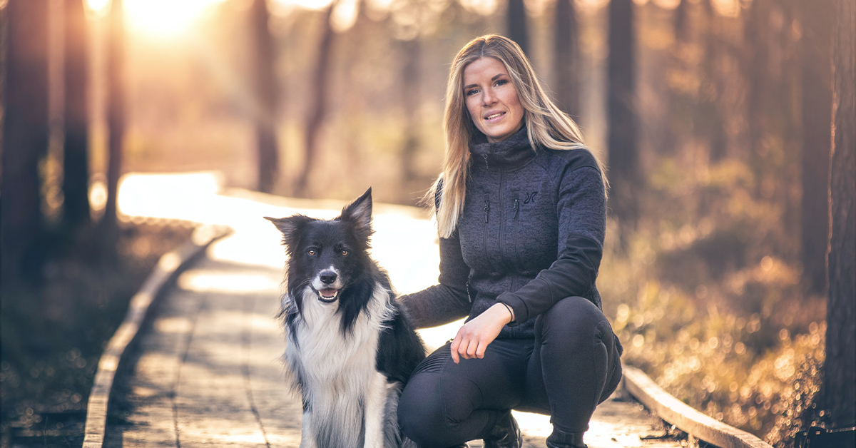 a woman and a dog on a hike.jpg