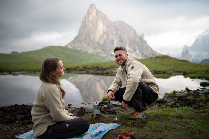 man and woman make coffee out in nature.jpg